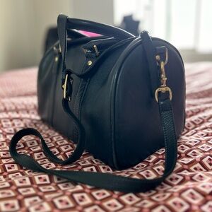 Clare V. Navy Blue Leather Bag with Contrasting red zipper.